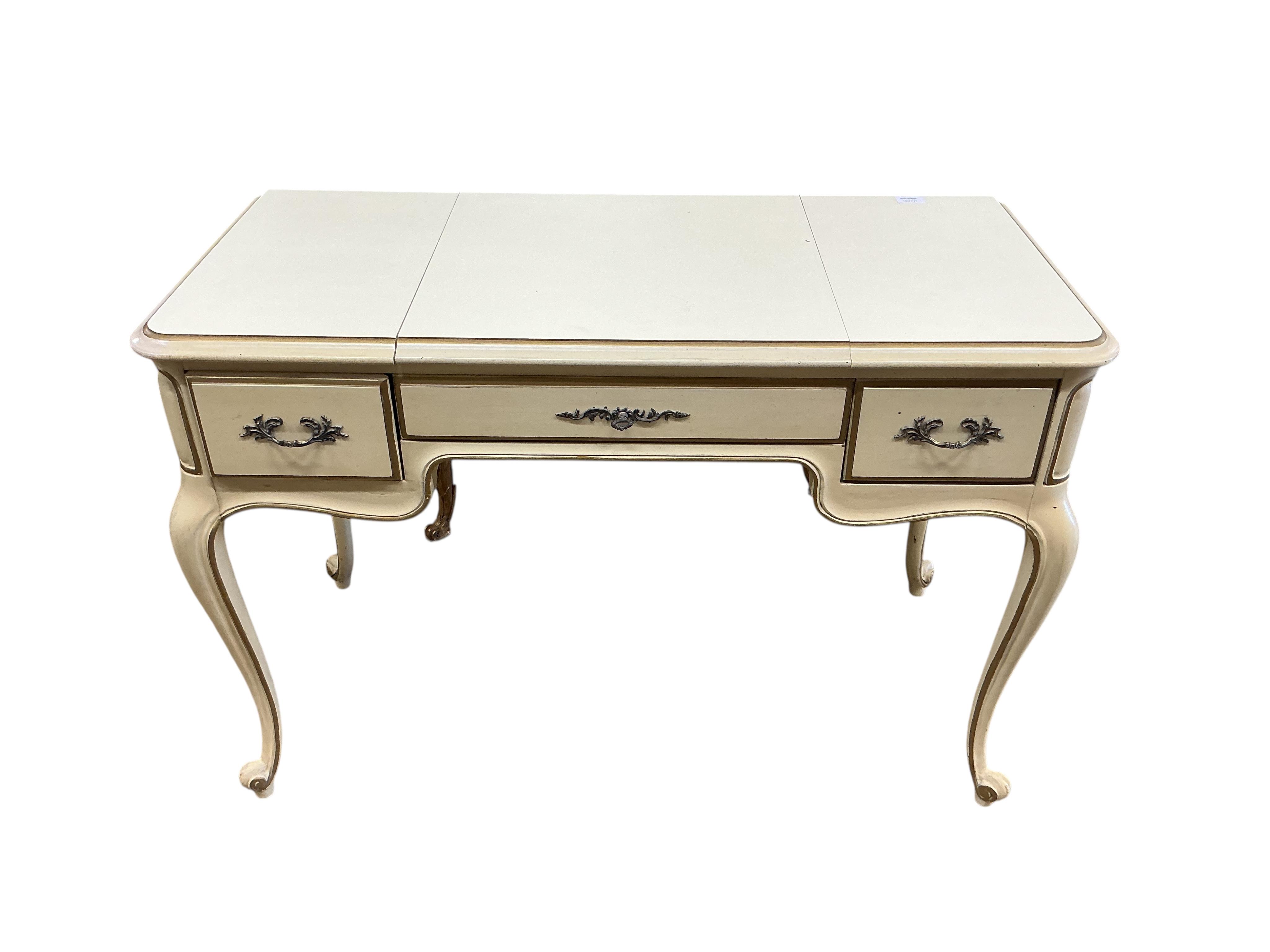 An American cream and gilt painted dressing table, width 112cm, depth 51cm, height 75cm